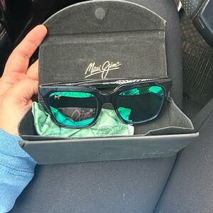Maui Jim Sunglasses with Black Frames and Teal Lenses